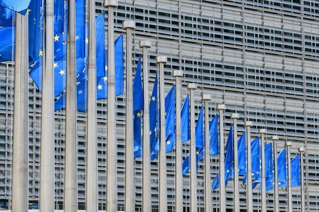The Berlaymont Building and European Flags	