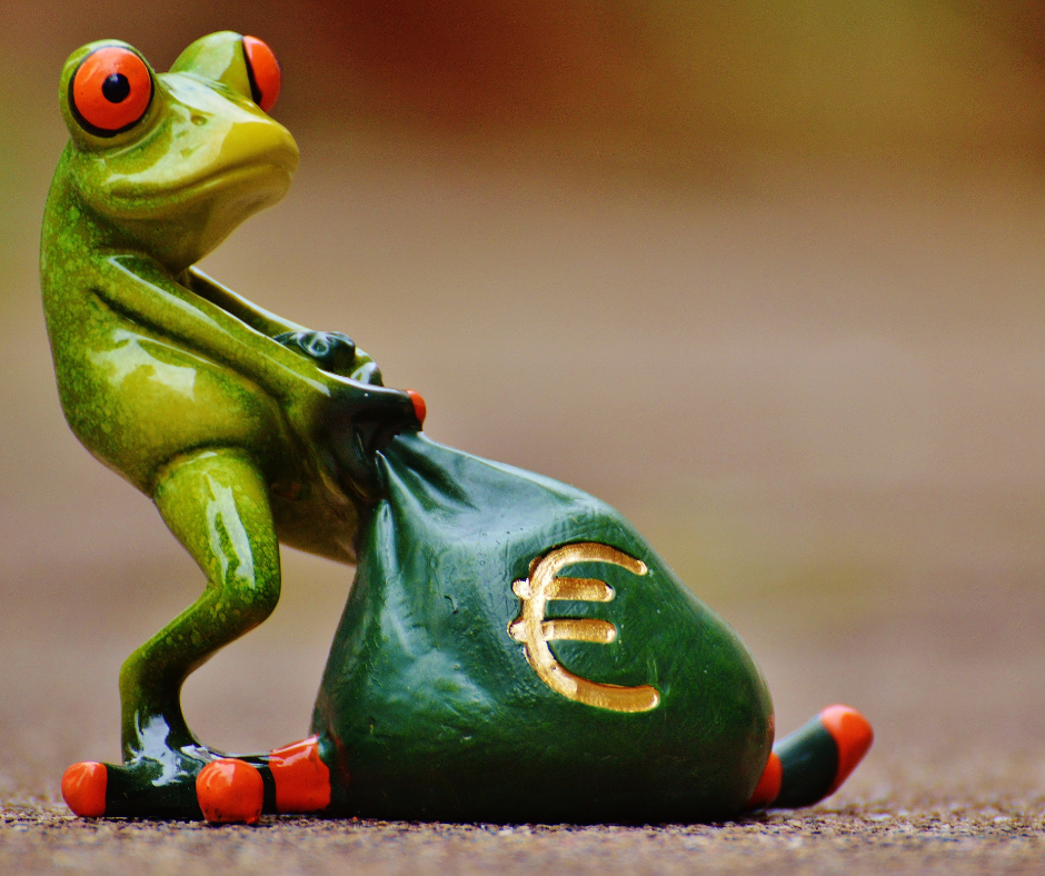 ceramic frog trying to carry a heavy bag marked with the euro currency sign